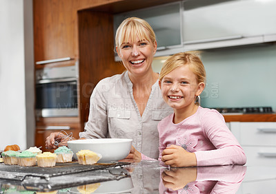 Buy stock photo Mother, portrait or child baking in kitchen or happy family with an excited girl learning cupcake recipe. Home, daughter or proud mom with muffin or smile for helping or teaching kid for development