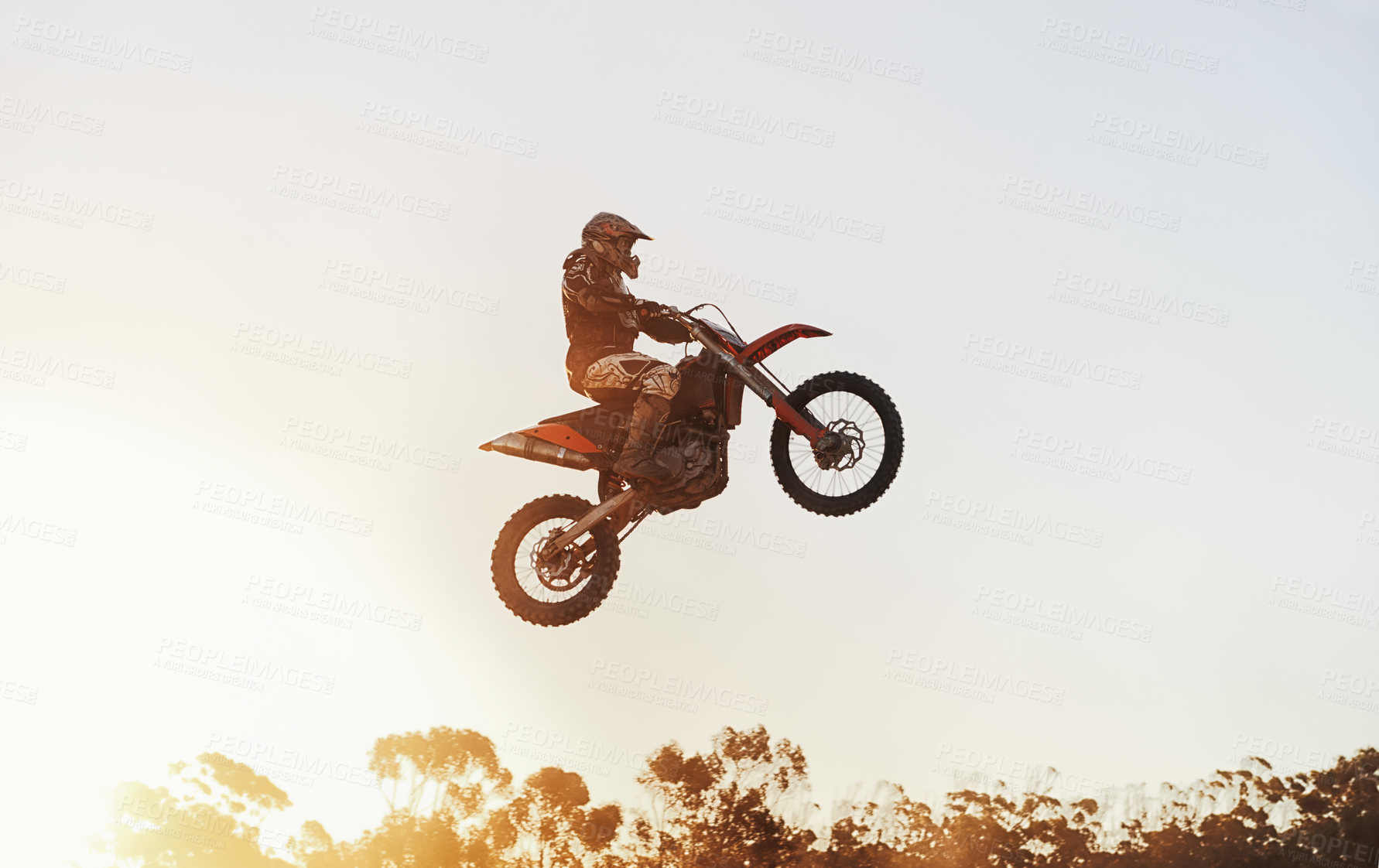 Buy stock photo Person, jump and motorcyclist in the air with sunset on mockup for trick, stunt or ramp on outdoor dirt track. Expert rider on motorbike with lift off for extreme sports or rally challenge in nature