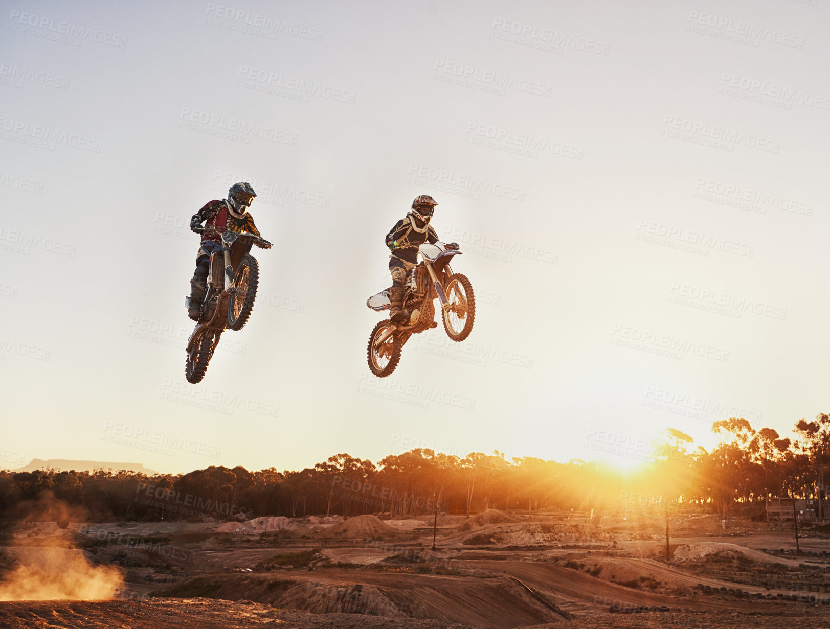 Buy stock photo Adventure, speed and motorbike for a competition during a race outdoor for extreme sports. Action, men and motorcycle on racetrack for sport jump on fast transportation in the dirt with sunset.