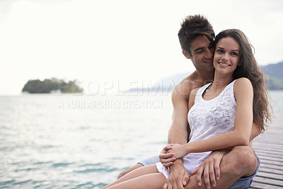 Buy stock photo Love, smile and couple at ocean on vacation, holiday or travel together outdoor at pier. Romance, man and happy woman at sea for adventure, care and connection in summer by water in nature on mockup