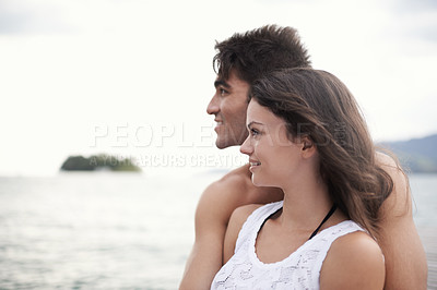 Buy stock photo Couple, embrace and travel to ocean on vacation, love and relax by water on summer holiday. People, peace and bonding for relationship in outdoors, support and hug on weekend trip to sea or nature