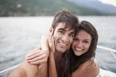 Buy stock photo Portrait, selfie and happy couple at ocean on boat for vacation, holiday or travel together outdoor. Face, woman and man taking pictures at sea for adventure, hug and connection in summer on a ship