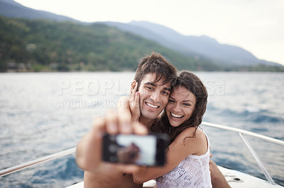 Buy stock photo Couple, vacation and selfie on boat, ocean and Bali for getaway with smile and affectionate. Man, woman and love for phone, happy and travel on yacht and summer holiday by mountain and water