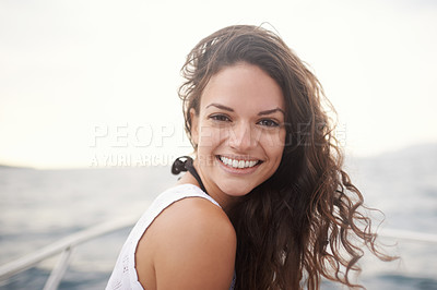 Buy stock photo Woman, portrait and smile on yacht in outdoors, happy and travel to ocean on summer holiday. Female person, cruise and relax on boat transportation in water, peace and sailing in Italy on vacation