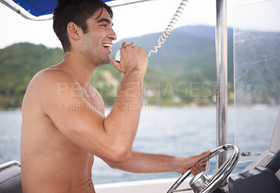 Buy stock photo Man, boat and sailing sea with radio communication or navigation on coastal water as direction, location or voyage. Male person, steering wheel and marine conversation for trip, transport or nautical