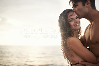 Buy stock photo Portrait, happy couple and kiss at sea at sunset on vacation, holiday or travel together. Face, man and woman at ocean for adventure, romance or connection in summer by water for love on mockup space