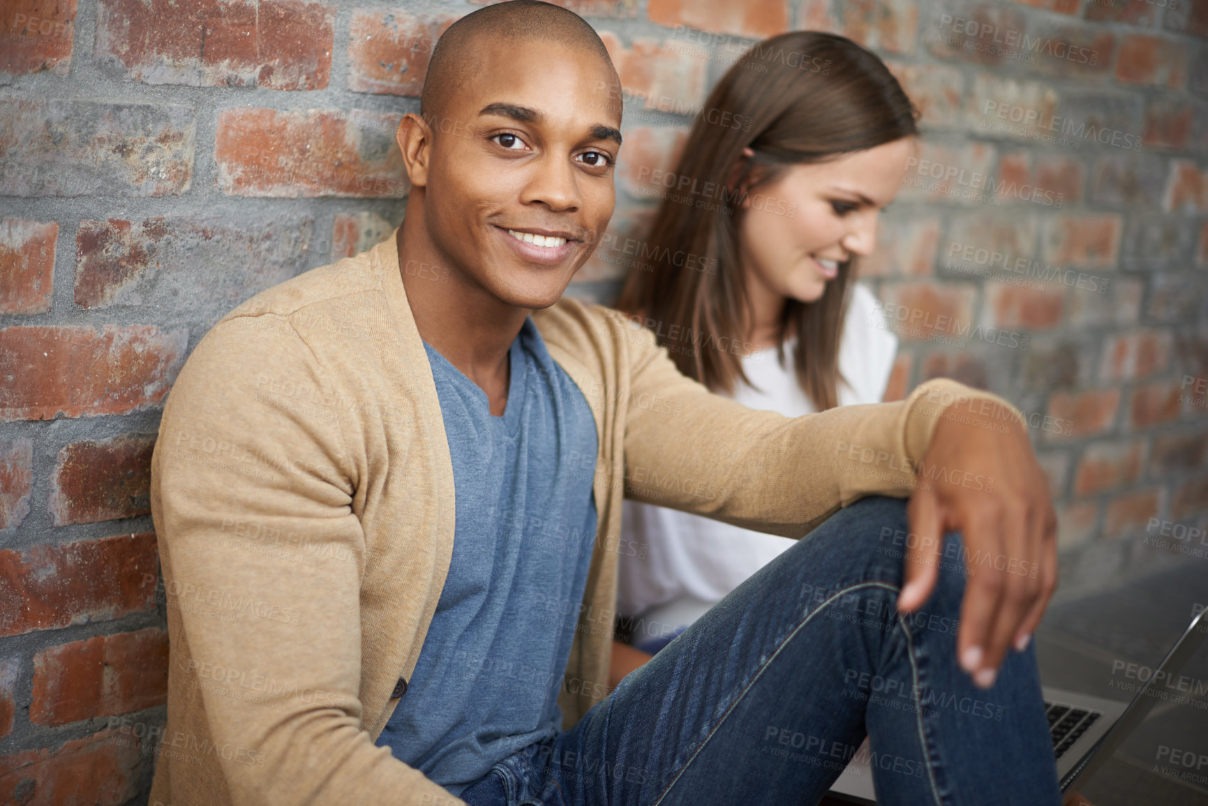 Buy stock photo African man, university student and portrait in hallway, studying and smile with friend. Technology, laptop and learning for test or exam, gen z learners and diverse scholars sitting on campus floor