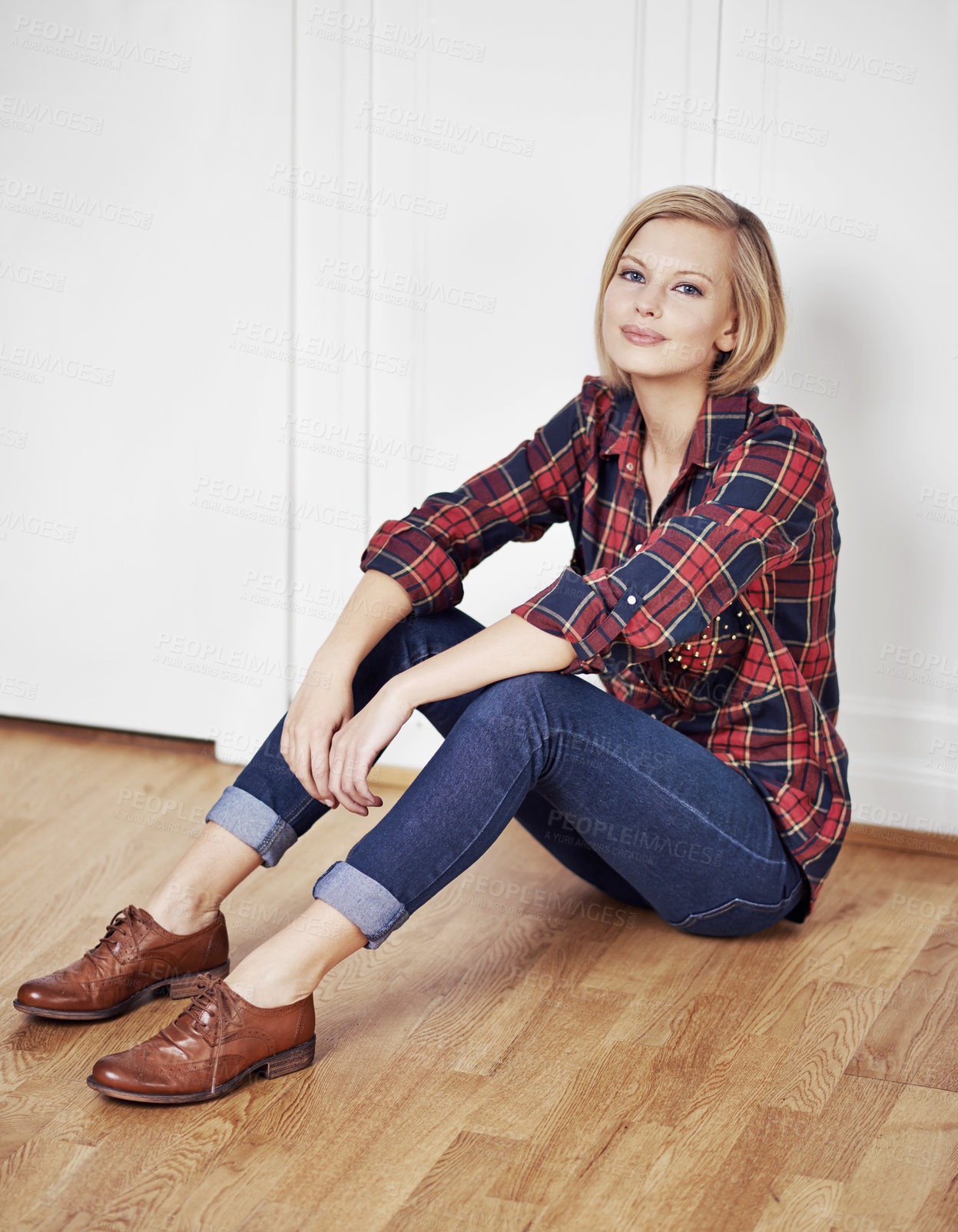 Buy stock photo A portrait of a beautiful young woman sitting on a wooden floor at home