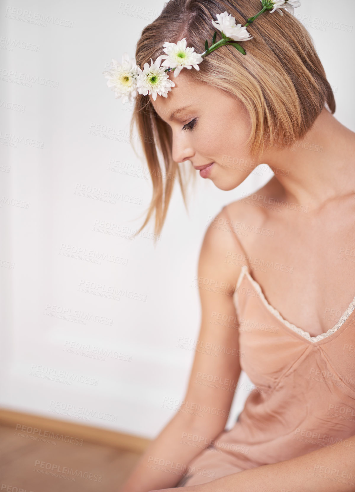 Buy stock photo Woman, fashion and flower crown for peace, relaxation and thinking in bedroom with beauty. Female person, floral tiara or bloom for calm, glamorous and hair style in spring for skincare routine