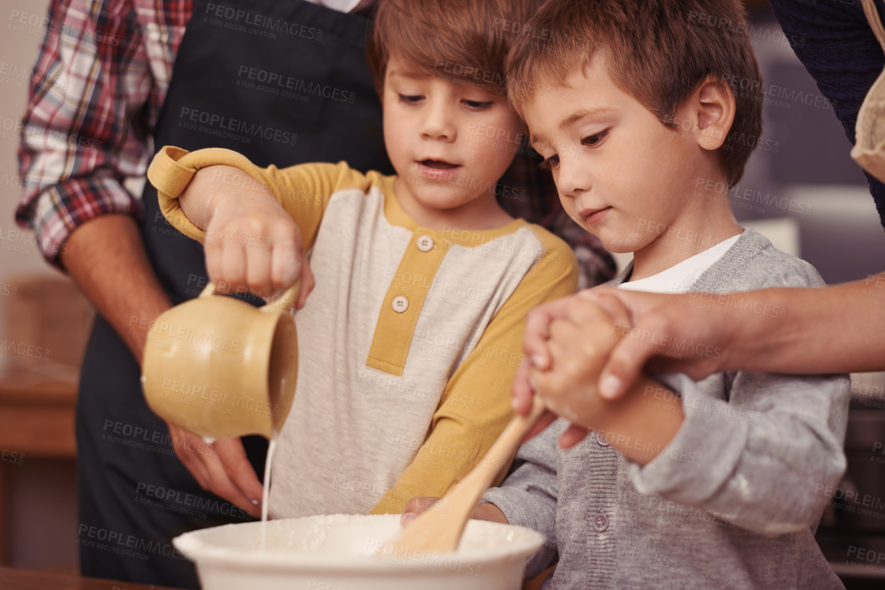 Buy stock photo Children, learning or baking in kitchen with ingredients, home or support for dessert cake with love. Happy family, teaching or bowl for cookies on table, care or bonding together on holiday in house