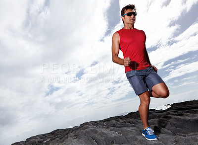 Buy stock photo Athlete male person, running and outdoor for fitness, health and wellness in activewear and sunglasses. Man, jog and seaside for sport, train and gym in workout and exercise for cardio routine 