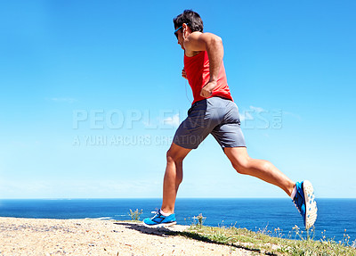 Buy stock photo Man, beach and earphones for workout outdoors, jog and athlete for performance training by sea. Male person, full body and back for run in nature, blue sky and listen to music for exercise on mockup