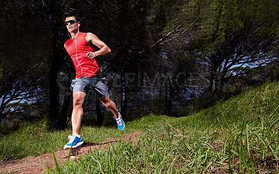 Buy stock photo Athlete, man and running in nature fitness, health and wellness in outdoors. Runner, training and exercise in sportswear for workout, strong muscle and cardio in forest or wood for sports or activity