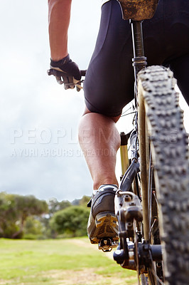 Buy stock photo Cyclist, feet and closeup on bike in nature for training, race or workout for adventure, fitness and health. Person, athlete and bicycle for triathlon, speed and balance in bush, field and outdoor