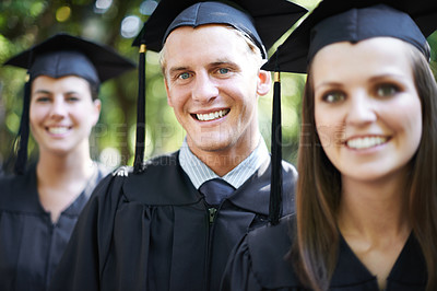 Buy stock photo Student, portrait and graduation with friends outdoor at university, college and achievement ceremony. Education, campus and class at certificate, degree and school event with a smile from diploma  