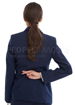 Buy stock photo Rear view shot of a businesswoman with her fingers crossed behind her back in studio