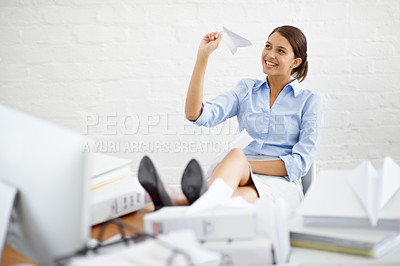 Buy stock photo Business woman throw paper plane in office for ideas, vision and relaxing at desk with paperwork for management. Happy professional or corporate person on break, paperwork and creative inspiration