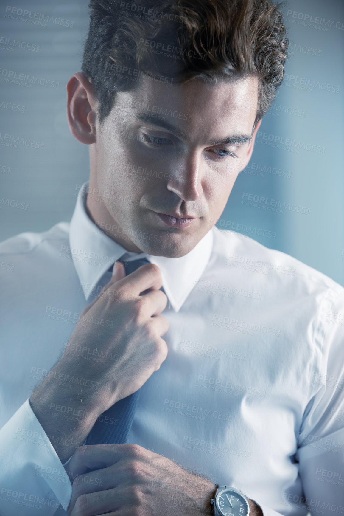 Buy stock photo Face, thinking and getting ready with business man in studio on white background for start of career. Corporate, company and professional with serious young employee dressing for interview at work