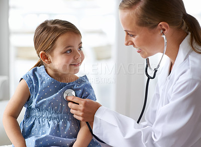Buy stock photo Cropped shot of an adorable young girl with her pediatrician