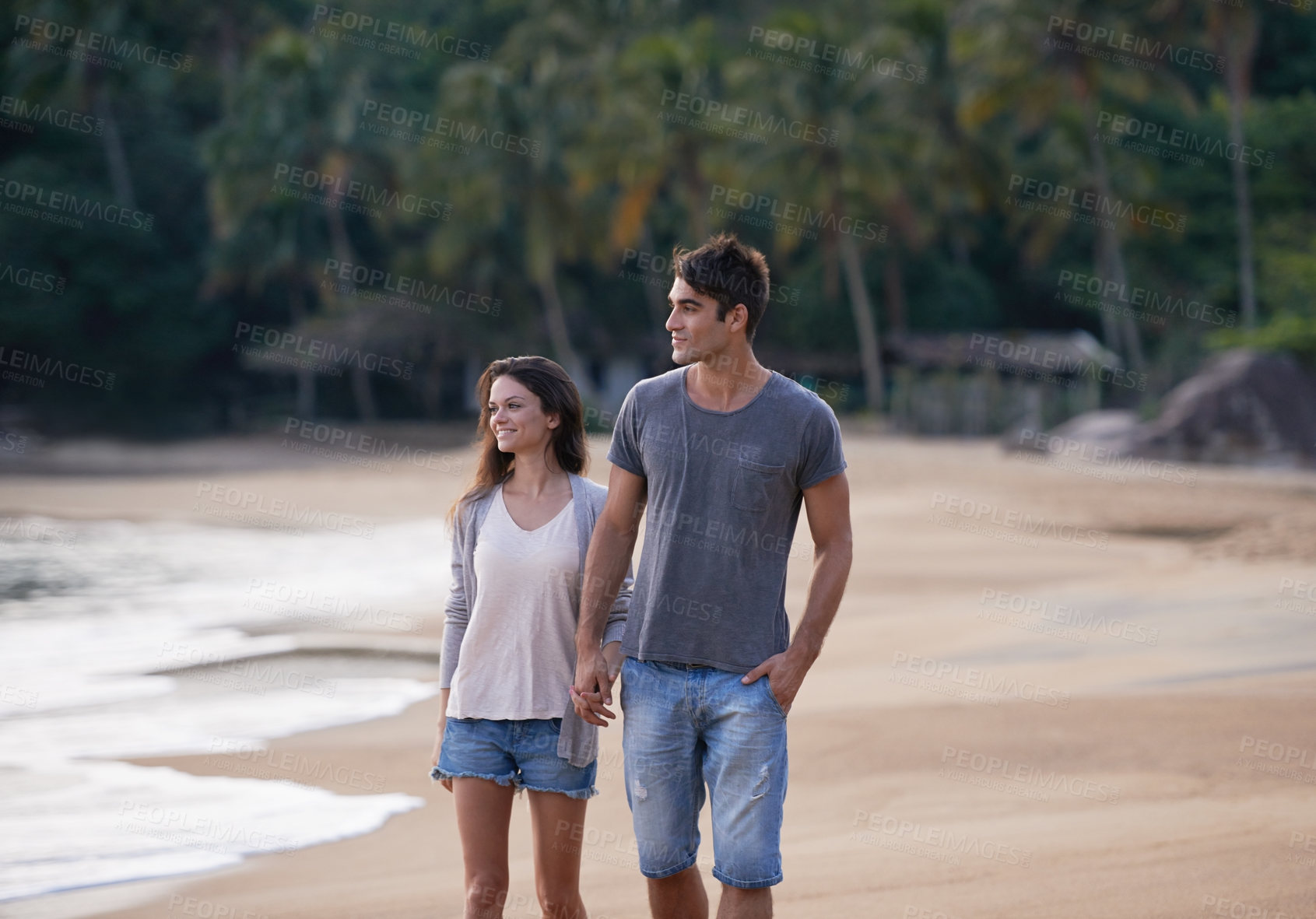 Buy stock photo Holding hands, walking and couple on beach for vacation, adventure or holiday for tropical travel. Nature, love and young man and woman by ocean or sea for romantic date on weekend island trip.