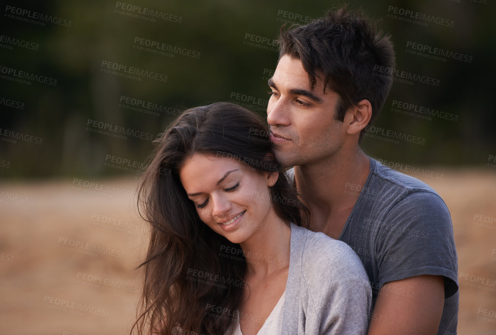 Buy stock photo Couple, relax and embrace outdoor with love in nature on holiday or vacation in summer. People, smile and calm moment together on date or travel in Florida to beach and hug partner with gratitude