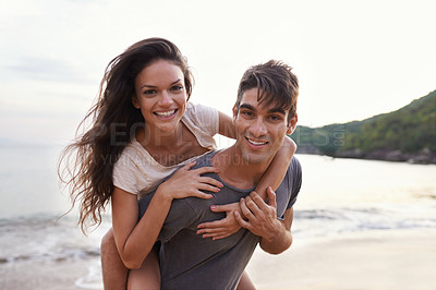 Buy stock photo Couple, beach and piggyback with sea, smile and nature with travel and date for relationship. Man, woman and indonesia ocean for adventure, vacation and tropical holiday with sunshine and portrait