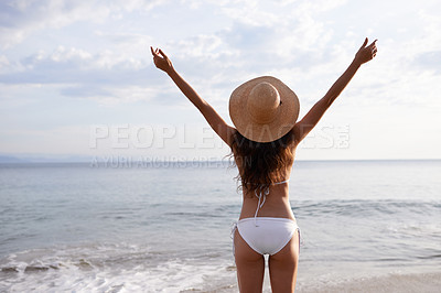 Buy stock photo Outdoor, hands up or woman at a beach for travel adventure to explore on holiday vacation. Tourist, ocean or back of female person with open arms in nature for fresh air, freedom or gratitude in Bali