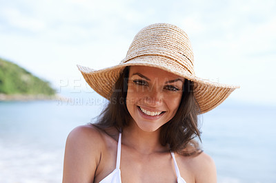 Buy stock photo Beach, smile and portrait of woman for holiday, vacation and adventure for tropical travel. Happy, nature and female person with hat by ocean or sea water on outdoor summer weekend trip by island.