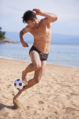 Buy stock photo Male sportsman, soccer and sand on beach, swimwear and training for exercise. Bathing suit, football and man athlete on holiday and fun on shoreline, summer and workout and outdoor on vacation