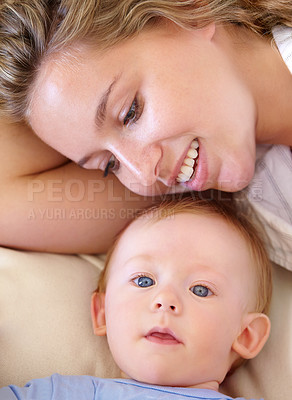 Buy stock photo Baby, cute and happy with mother, relaxing and love together with child and care for motherhood. Infant, mom and smile for affection, nurture and home for growth and babysitting with family bonding