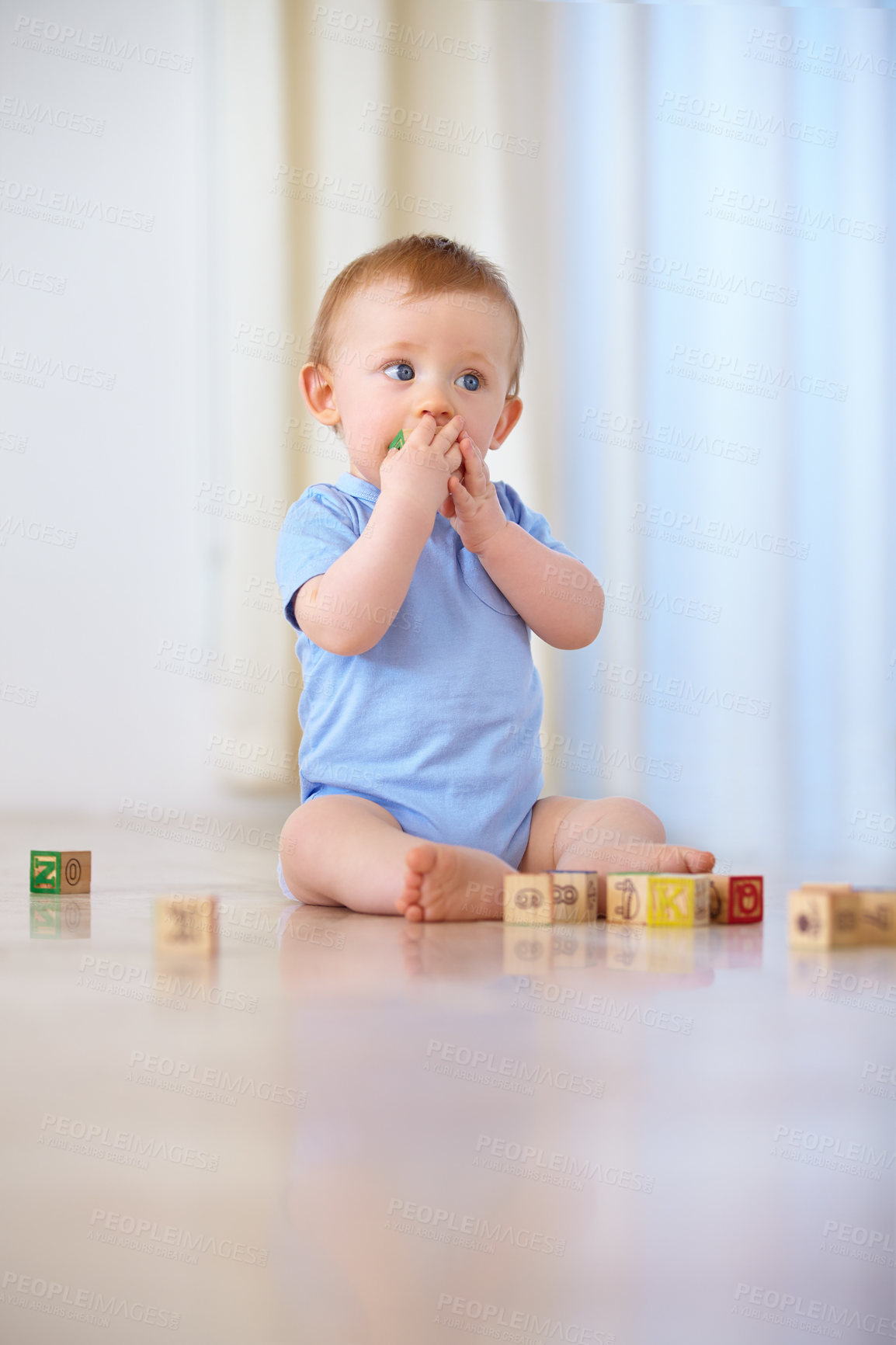 Buy stock photo Baby, wooden blocks and playing with toys for early childhood development or youth at home. Little boy, cute toddler or child on floor with shape or cube for building, learning or skills at the house