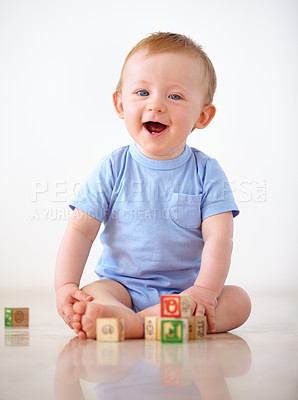 Buy stock photo Shot of an adorable baby boy in his home