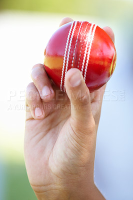 Buy stock photo Cricket, fitness and hand of athlete with ball at a game for catch on outdoor pitch. Sports, active and closeup of wicket keeper with equipment for practice, training or match on field with technique