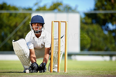 Buy stock photo Cricket, sports and a man as wicket keeper on a pitch for training, game or competition. Male athlete behind stumps with gear for action, playing professional sport and exercise for fitness or mockup