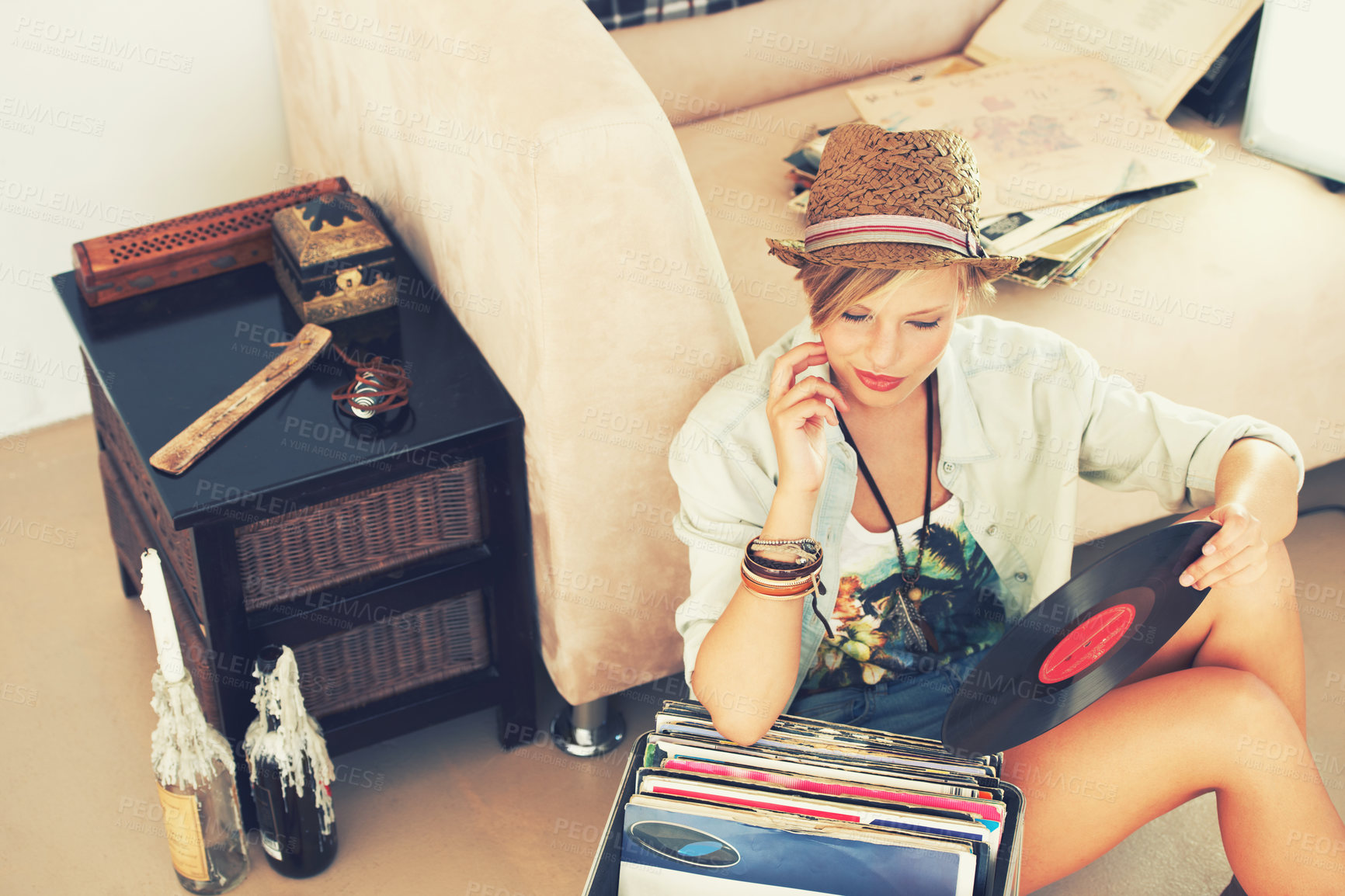 Buy stock photo Woman, hat and record with collection, retro and living room floor for relaxation. Person, couch and vintage for hobby, happiness and stress relief with trendy music and summer recreation with style