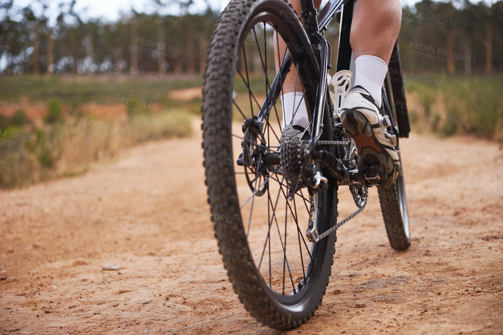 Buy stock photo Cropped shot of a cyclist riding outdoors