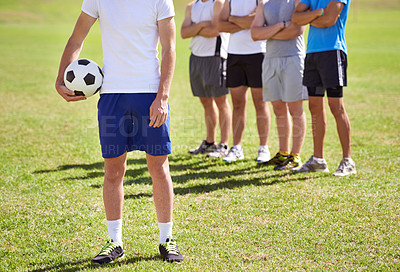 Buy stock photo Person, team and hand holding soccer ball for game, training and competition with fitness. People, group and football player with coach, captain or leader for sports, exercise or workout for contest