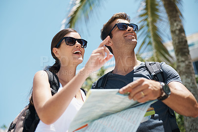 Buy stock photo Travel, map and couple on vacation together for adventure, holiday and sightseeing in outdoor for summer. Tourist, smiling and pointing at location for backpacking and trip on journey in sunshine    