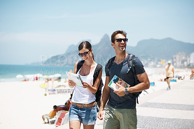 Buy stock photo Couple, map and beach with smile in summer, thinking or excited with search for direction on vacation. Woman, man and chart for location, landmark and travel for memory by sea with nature in Italy