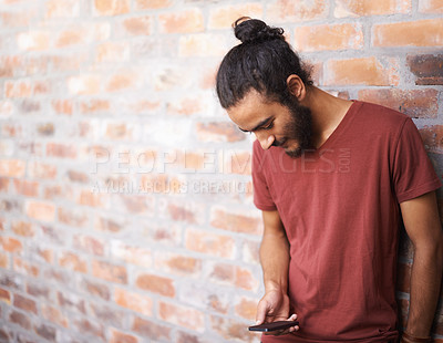 Buy stock photo School, phone and university with man at brick wall space for social media, technology or internet. Eduction, learning and scholarship with male student on college campus for connection and contact