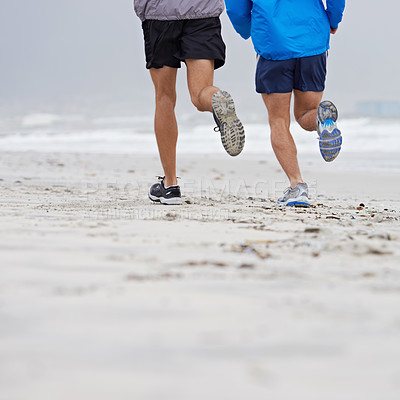 Buy stock photo Beach, legs or friends running for fitness, wellness or training outdoor in nature to workout for body health. Ocean, shoes or people together for exercise, cardio or sport with back on mockup space