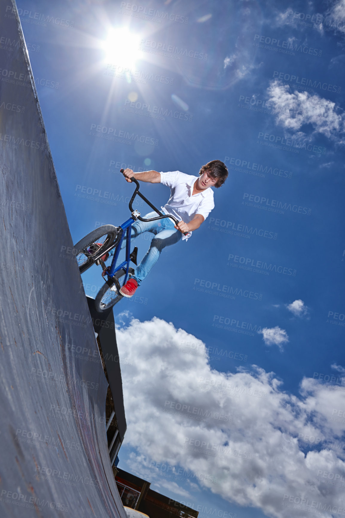 Buy stock photo Ride, bike and teen on ramp for sport performance, jump or training for event at park with blue sky mockup. Bicycle, stunt or kid balance on edge of board in trick for cycling competition challenge