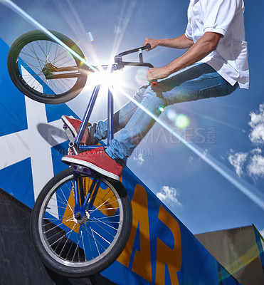 Buy stock photo Ramp, trick and man with bicycle in air at park, event or competition for sport with risk and balance. Mockup, space or person in sky with fearless stunt on bike for fun adventure or action in summer