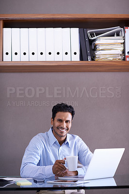 Buy stock photo Cropped shot of a handsome young businessman working at his desk