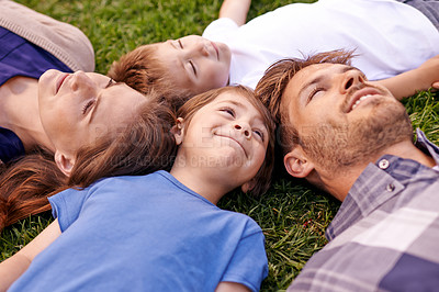 Buy stock photo Outdoor, mother and father with children relax on grass with happiness in park for weekend in New York. Kids, parents and family together with love in city for break for bonding, smile and enjoy