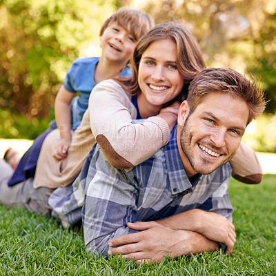 Buy stock photo Outdoor, portrait and family relax on grass with happiness in countryside of New York for holiday. Child, mother and father together with love in hometown for break to bond, smile and enjoy