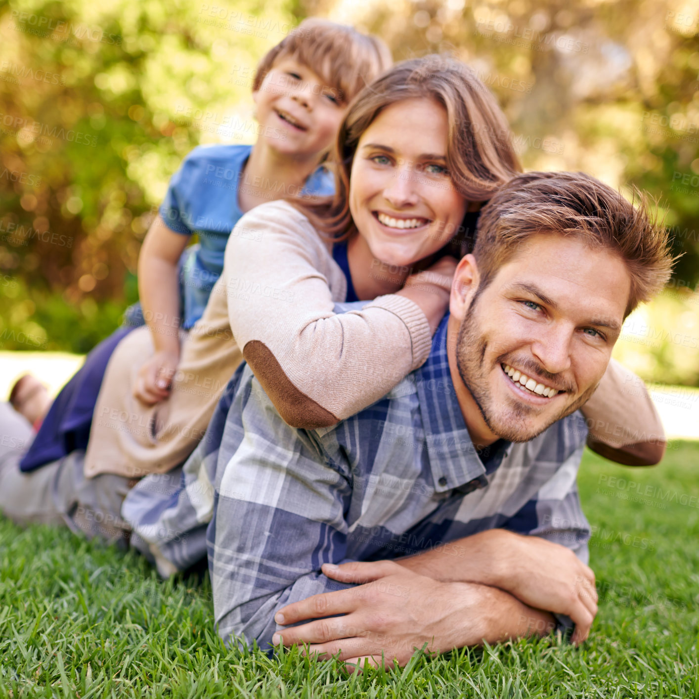 Buy stock photo Outdoor, portrait and family relax on grass with happiness in countryside of New York for holiday. Child, mother and father together with love in hometown for break to bond, smile and enjoy