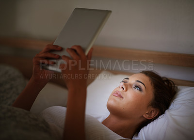 Buy stock photo Woman, tablet and bed at night, social media and entertainment with tech and relaxing for peace before sleep. Female person, browsing and online for home, internet and ebook or scrolling and research