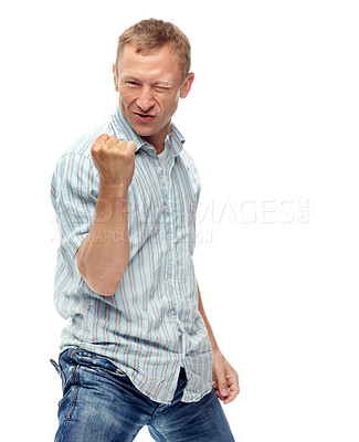 Buy stock photo Man, fist and celebration in studio portrait with success, goals and financial freedom by white background. Person, winner and excited for achievement, prize and competition with cheers for giveaway