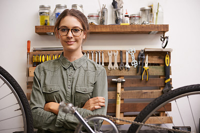 Buy stock photo Mechanic, woman and bicycle with tools and smile at workshop for repair, maintenance with small business. Entrepreneur, garage and expert with diy for bike with equipment for service and upgrade